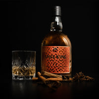 studio shot of Spice King HIghland and Islay photographed with a glass and spices